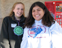 A volunteer decorates cookies